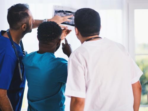 Healthcare professionals looking at an X-Ray
